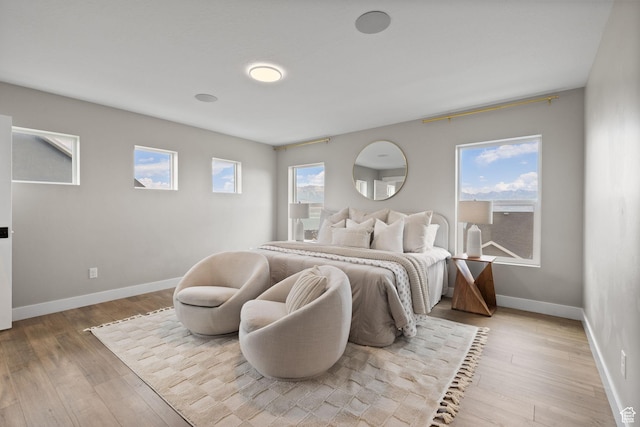 3256 S Iron Hill Cir, Saratoga Springs, UT 84045 - bedroom with baseboards and light wood-style flooring