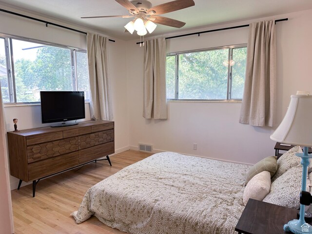 3269 Liberty Ave, Ogden, UT 84403 - bedroom with light wood-style flooring and a ceiling fan