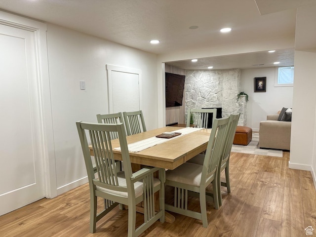 3269 Liberty Ave, Ogden, UT 84403 - dining room featuring light wood-style floors, a fireplace, and recessed lighting