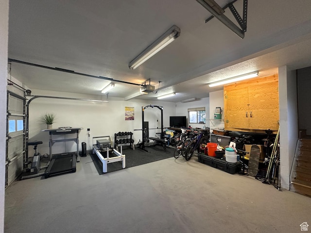 3269 Liberty Ave, Ogden, UT 84403 - garage with a garage door opener and a workshop area