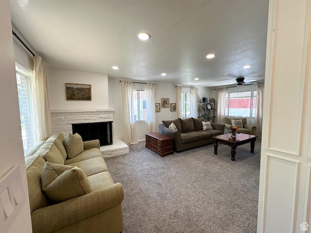 3269 Liberty Ave, Ogden, UT 84403 - carpeted living room with recessed lighting, plenty of natural light, a stone fireplace, and ceiling fan