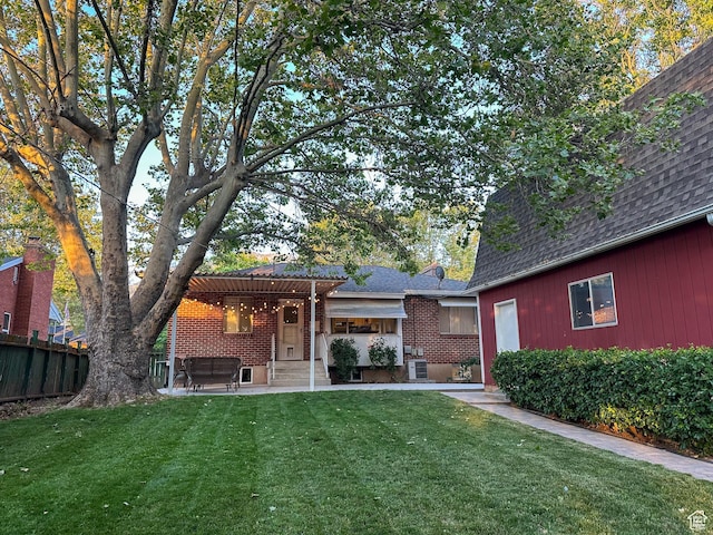3269 Liberty Ave, Ogden, UT 84403 - back of house with a pergola, a shingled roof, a patio, and brick siding