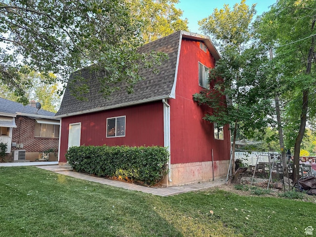 3269 Liberty Ave, Ogden, UT 84403 - view of home's exterior with roof with shingles, a lawn, and a gambrel roof