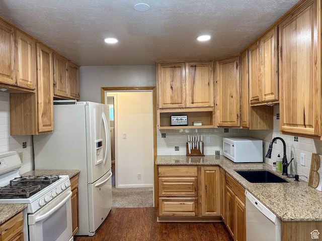 3269 Liberty Ave, Ogden, UT 84403 - kitchen with white appliances, decorative backsplash, open shelves, dark wood-style flooring, and light stone countertops