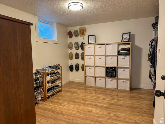 3269 Liberty Ave, Ogden, UT 84403 - wine room with light wood-style floors and a textured ceiling