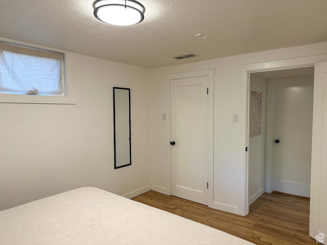 3269 Liberty Ave, Ogden, UT 84403 - unfurnished bedroom with wood finished floors and a textured ceiling