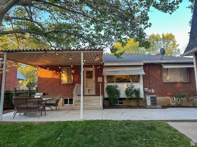 3269 Liberty Ave, Ogden, UT 84403 - rear view of house with brick siding and a patio area