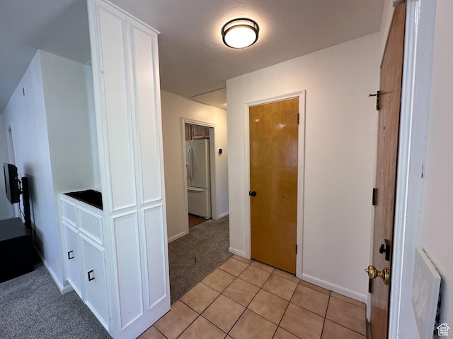 3269 Liberty Ave, Ogden, UT 84403 - hallway featuring light colored carpet and light tile patterned floors
