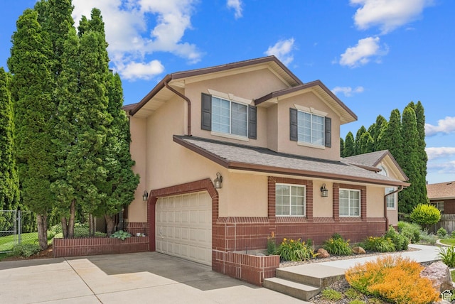 1087 W Barnes Dr, Kaysville, UT 84037 - view of front of property featuring an attached garage, stucco siding, and concrete driveway
