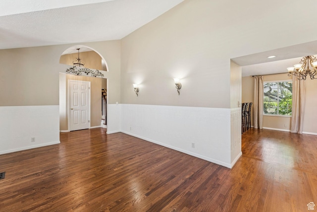 1087 W Barnes Dr, Kaysville, UT 84037 - spare room with a chandelier, wood finished floors, and lofted ceiling