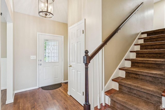 1087 W Barnes Dr, Kaysville, UT 84037 - entrance foyer with stairs, wood finished floors, and a chandelier