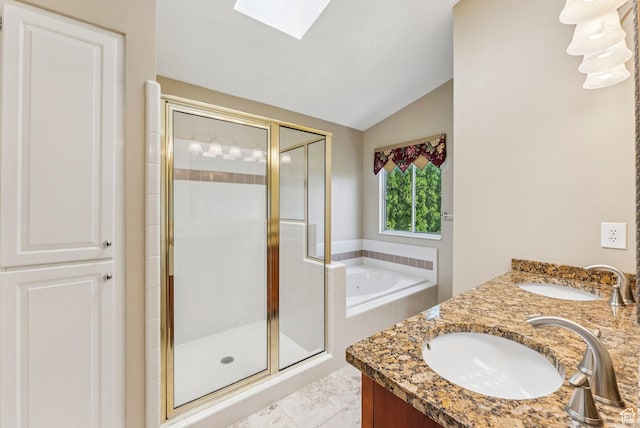 1087 W Barnes Dr, Kaysville, UT 84037 - full bathroom with vaulted ceiling, a bath, a shower stall, double vanity, and a skylight