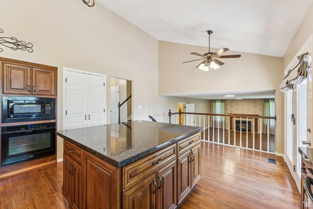 1087 W Barnes Dr, Kaysville, UT 84037 - kitchen featuring black appliances, a ceiling fan, dark wood finished floors, high vaulted ceiling, and brown cabinetry