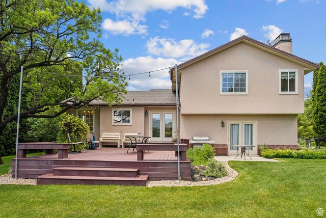1087 W Barnes Dr, Kaysville, UT 84037 - back of house featuring french doors, a wooden deck, a chimney, stucco siding, and a yard
