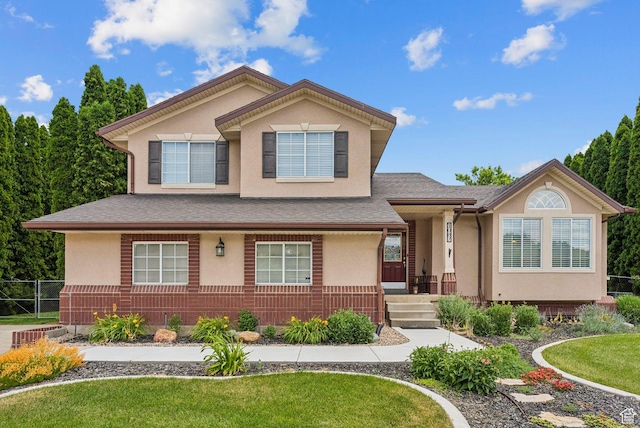 1087 W Barnes Dr, Kaysville, UT 84037 - view of front of home with stucco siding, a front yard, and roof with shingles