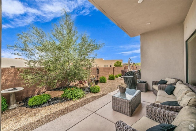 1472 W Pocket Mesa Dr, St George, UT 84770 - fenced backyard featuring an outdoor living space, a patio, and a grill