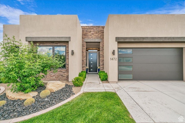 1472 W Pocket Mesa Dr, St George, UT 84770 - view of front of house with stone siding, concrete driveway, and stucco siding