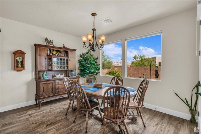 1472 W Pocket Mesa Dr, St George, UT 84770 - dining room featuring a chandelier and wood finished floors