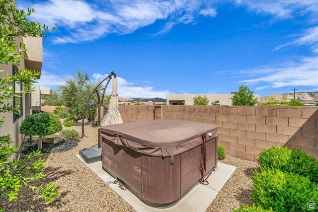 1472 W Pocket Mesa Dr, St George, UT 84770 - fenced backyard with a hot tub