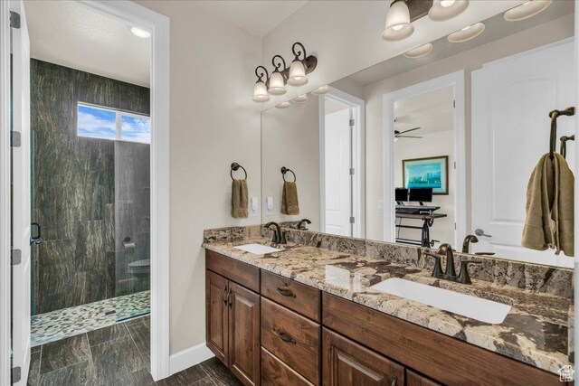 1472 W Pocket Mesa Dr, St George, UT 84770 - full bath with a stall shower, double vanity, and a ceiling fan