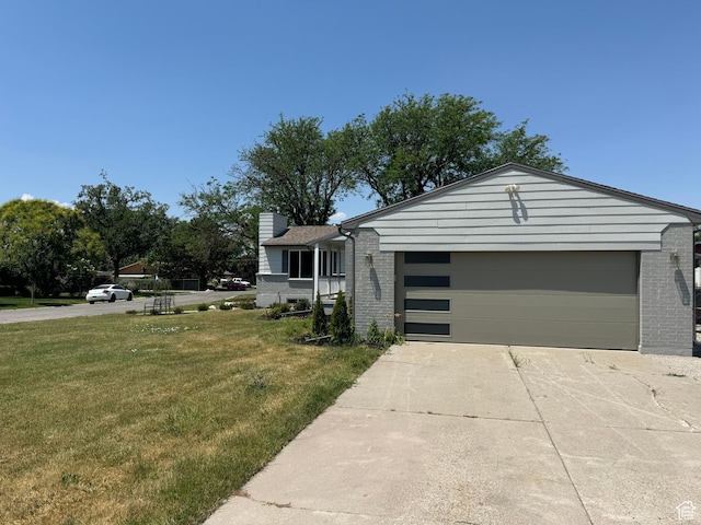 1371 E Skyview Dr, Millcreek, UT 84124 - view of front of home featuring brick siding, a front yard, an attached garage, and concrete driveway