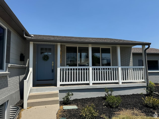 1371 E Skyview Dr, Millcreek, UT 84124 - property entrance featuring brick siding and covered porch