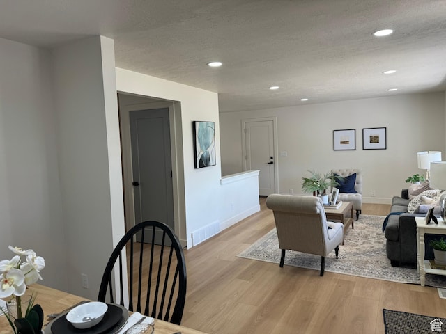 1371 E Skyview Dr, Millcreek, UT 84124 - living area featuring recessed lighting, light wood-style floors, and a textured ceiling