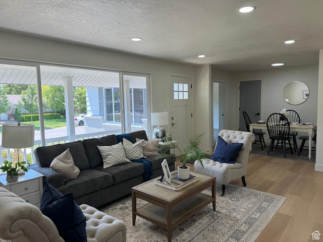 1371 E Skyview Dr, Millcreek, UT 84124 - living area featuring recessed lighting, light wood-style flooring, and a textured ceiling
