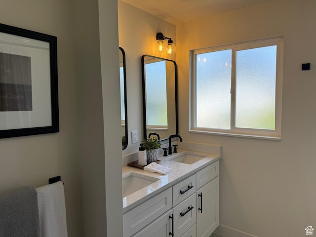 1371 E Skyview Dr, Millcreek, UT 84124 - bathroom featuring double vanity and baseboards