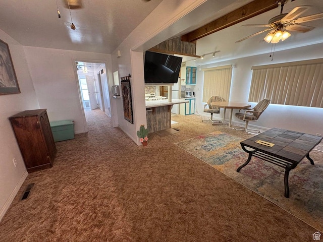 1225 N Dixie Downs Rd Unit 100, St George, UT 84770 - carpeted living room with a ceiling fan and baseboards