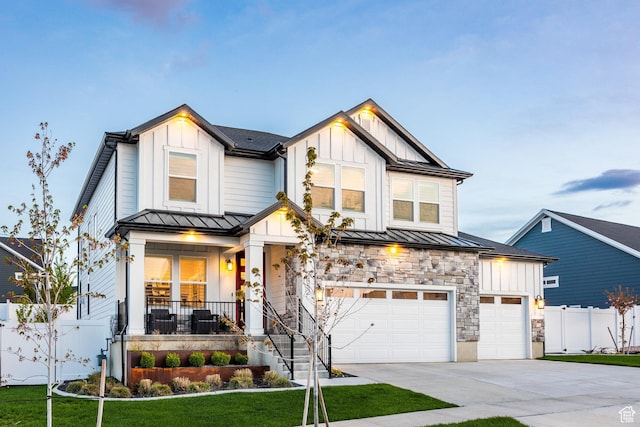 2452 E Lone Hill Dr Unit 324, Draper Ut Cnty, UT 84020 - modern farmhouse style home featuring a standing seam roof, board and batten siding, driveway, a porch, and a garage