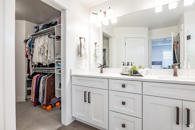 2452 E Lone Hill Dr Unit 324, Draper Ut Cnty, UT 84020 - bathroom with double vanity and a spacious closet