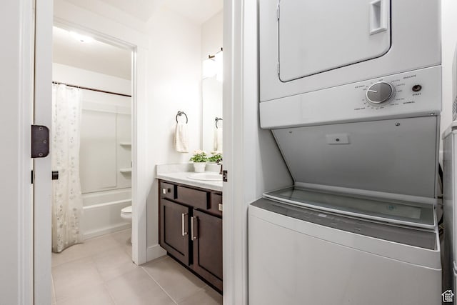 2452 E Lone Hill Dr Unit 324, Draper Ut Cnty, UT 84020 - laundry room featuring stacked washer / drying machine and light tile patterned floors