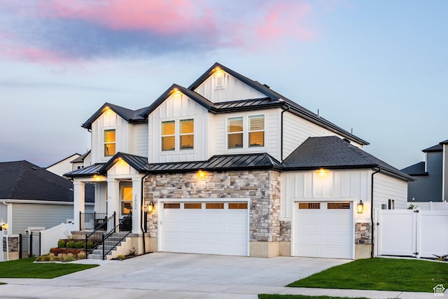 2452 E Lone Hill Dr Unit 324, Draper Ut Cnty, UT 84020 - modern inspired farmhouse with a standing seam roof, concrete driveway, board and batten siding, and stone siding