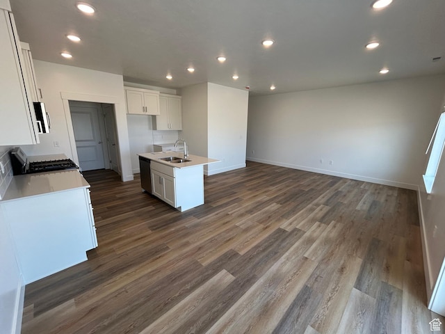 669 W 575 N Unit 552, Smithfield, UT 84335 - kitchen with stainless steel appliances, dark wood-style floors, white cabinetry, open floor plan, and recessed lighting