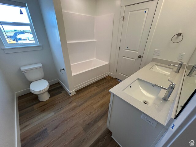 669 W 575 N Unit 552, Smithfield, UT 84335 - full bathroom featuring wood finished floors, double vanity, and shower / tub combination
