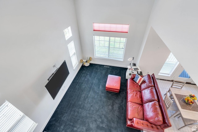 766 S Aspen Cir, Provo, UT 84606 - living area with carpet flooring and a high ceiling