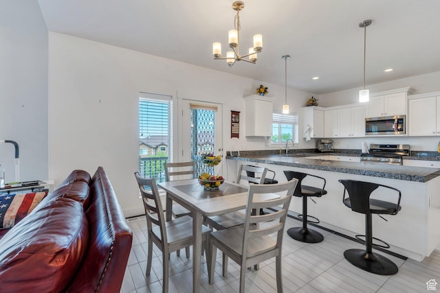 766 S Aspen Cir, Provo, UT 84606 - dining area featuring a chandelier and recessed lighting