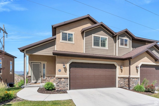 766 S Aspen Cir, Provo, UT 84606 - view of front of house featuring stone siding, stucco siding, a garage, and concrete driveway