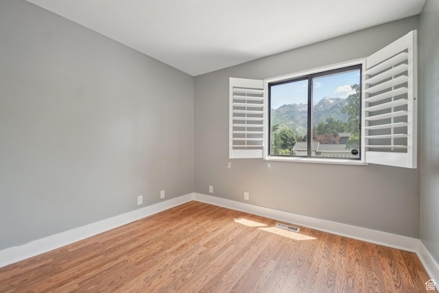 8892 S Flatiron Dr, Sandy, UT 84093 - empty room with wood finished floors and baseboards