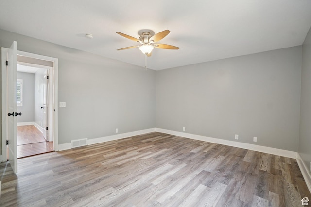 8892 S Flatiron Dr, Sandy, UT 84093 - empty room featuring ceiling fan, wood finished floors, and a smoke detector