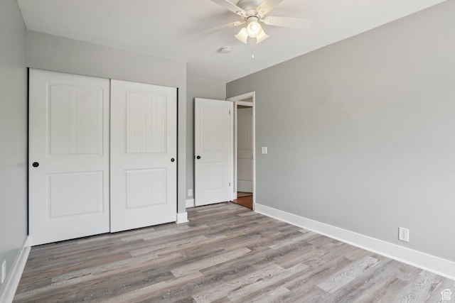 8892 S Flatiron Dr, Sandy, UT 84093 - unfurnished bedroom featuring wood finished floors, a closet, and a ceiling fan