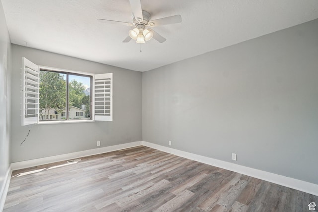 8892 S Flatiron Dr, Sandy, UT 84093 - unfurnished room featuring wood finished floors and ceiling fan