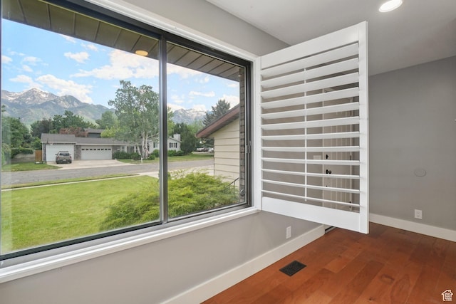 8892 S Flatiron Dr, Sandy, UT 84093 - unfurnished room with wood finished floors, a mountain view, and recessed lighting