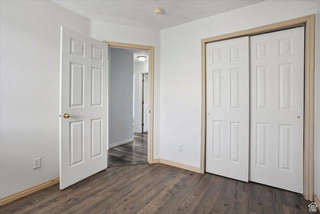109 E 1875 N, Ogden, UT 84414 - unfurnished bedroom with dark wood-style flooring and a closet