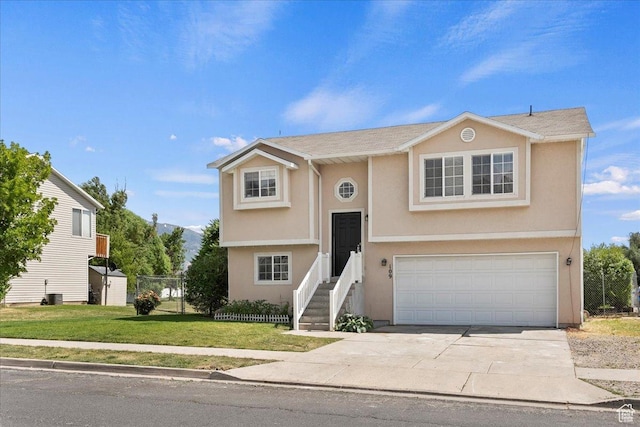 109 E 1875 N, Ogden, UT 84414 - bi-level home featuring an attached garage, stucco siding, and driveway