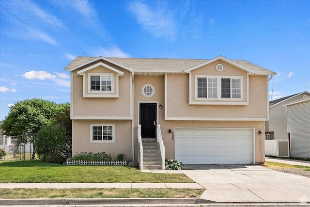 109 E 1875 N, Ogden, UT 84414 - bi-level home featuring an attached garage, stucco siding, and concrete driveway