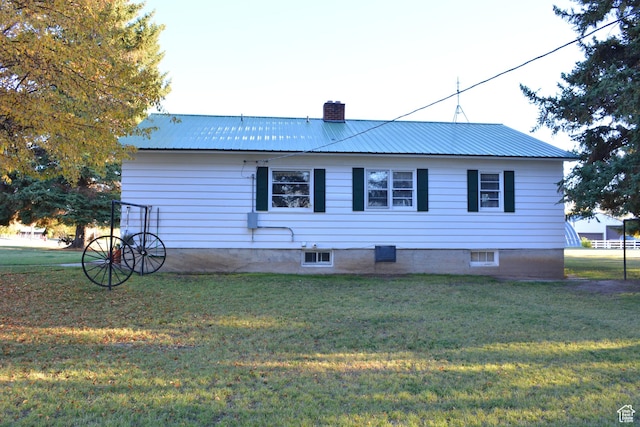 114 W 7th St, Georgetown, ID 83239 - rear view of house with a chimney, a yard, and a metal roof