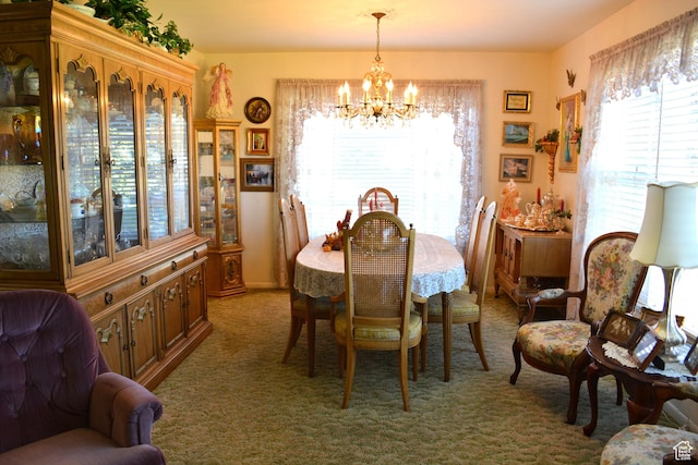 114 W 7th St, Georgetown, ID 83239 - dining area with a chandelier, plenty of natural light, and carpet flooring
