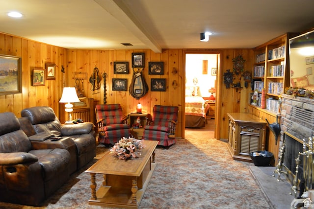 114 W 7th St, Georgetown, ID 83239 - living area featuring wood walls, a stone fireplace, and carpet